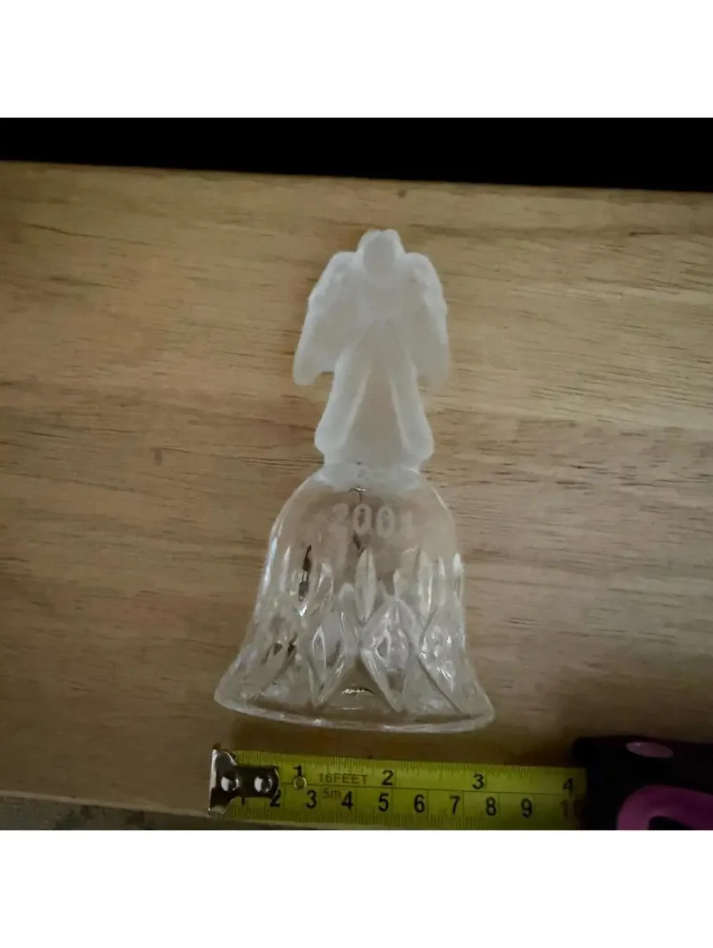 vintage frosted angel sits atop a crystal bell etched with the year 2001.